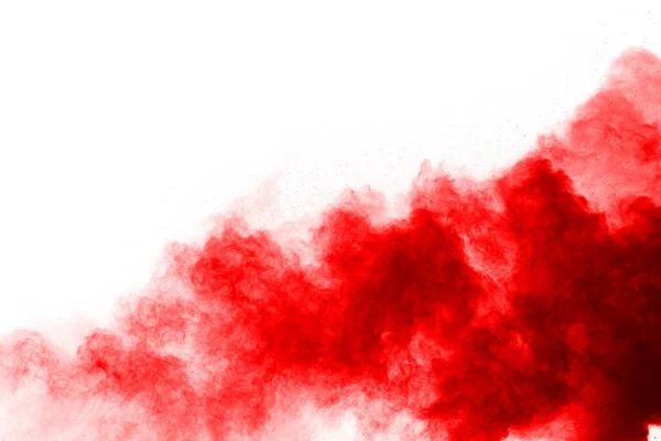 Beyaz arka planda izole edilmiş kırmızı barutun patlaması hareketsiz. Kırmızı toz bulutunun soyut tasarımı. Parçacık patlaması ekran koruyucusu, duvar kağıdı