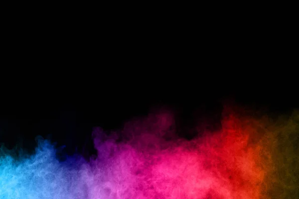 abstract colored dust explosion on a black background.abstract powder splatted background,Freeze motion of color powder exploding/throwing color powder, multicolored glitter texture.