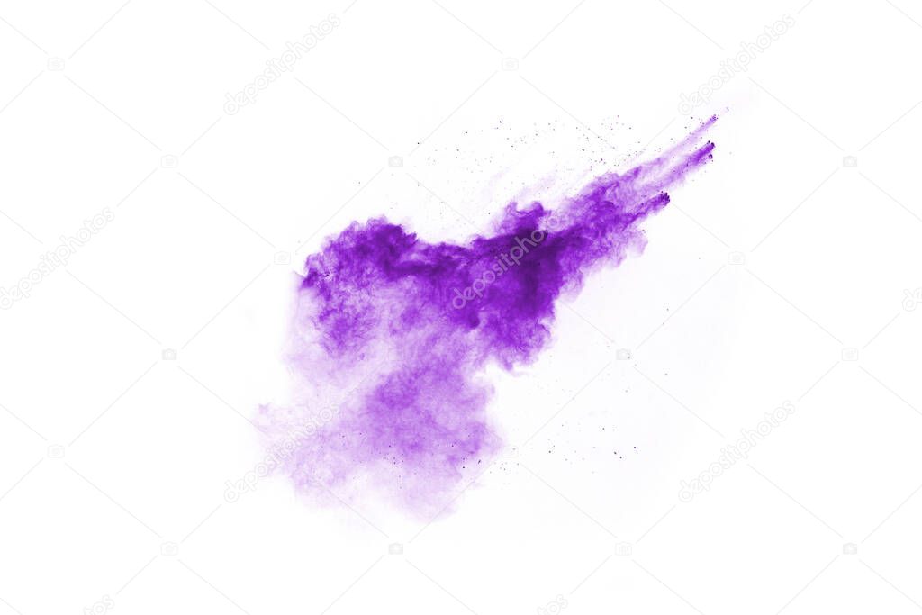 Powder explosion. Closeup of a purple dust particle explosion isolated on white. Abstract background.