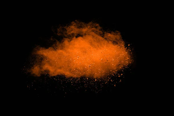 Freeze motion of Orange powder exploding, isolated on black background. Abstract design of red dust cloud.