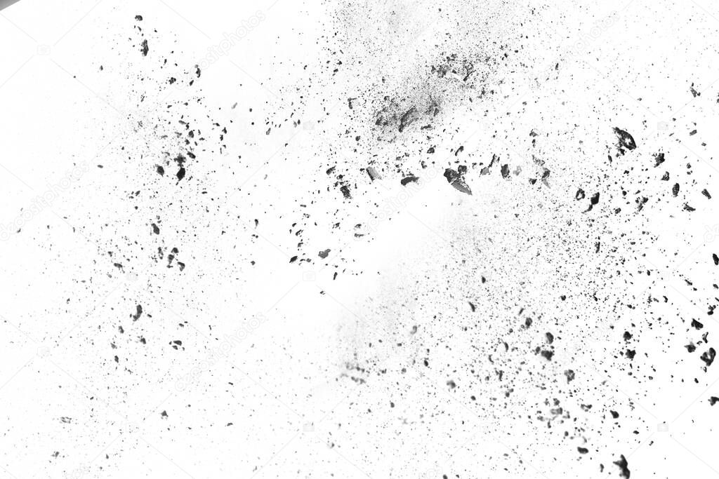 particles of charcoal on white background,abstract powder splatted on white background,Freeze motion of black powder exploding or throwing black powder.