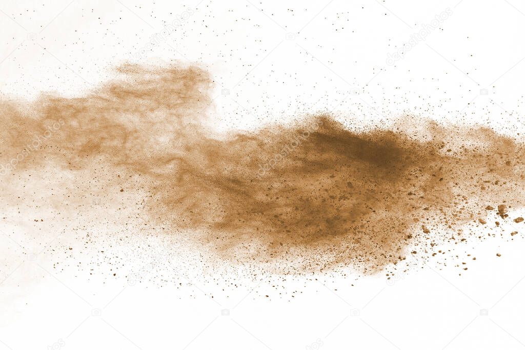 Brown color powder explosion on white background. Colored cloud. Colorful dust explode. Paint Holi.