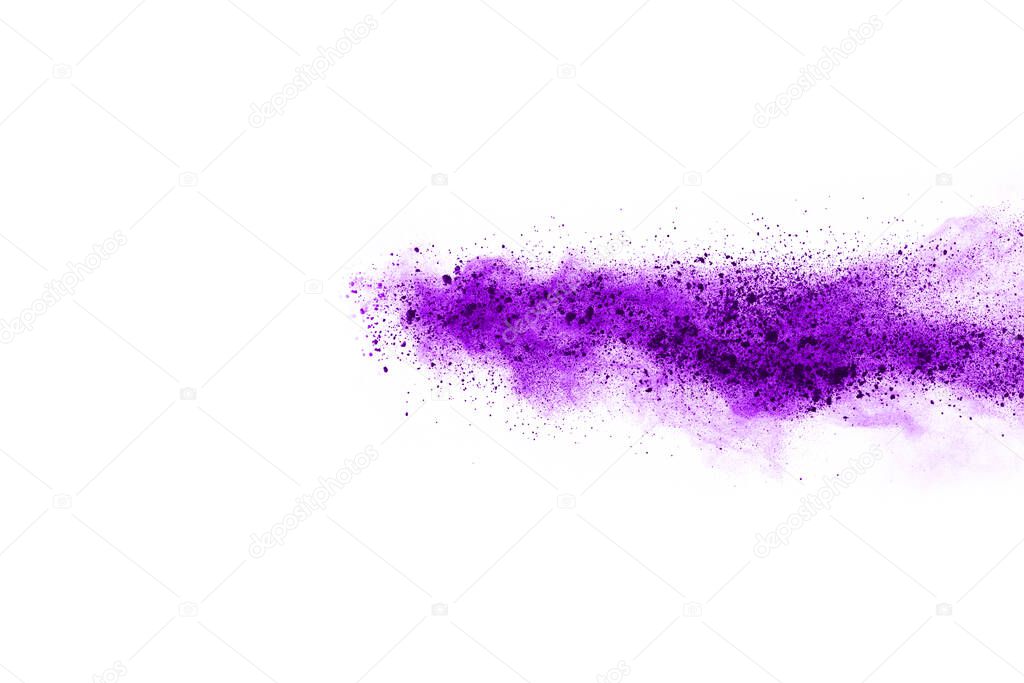 Powder explosion. Closeup of a purple dust particle explosion isolated on white. Abstract background.