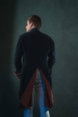Rear view of historical empire man in jacket. clipart