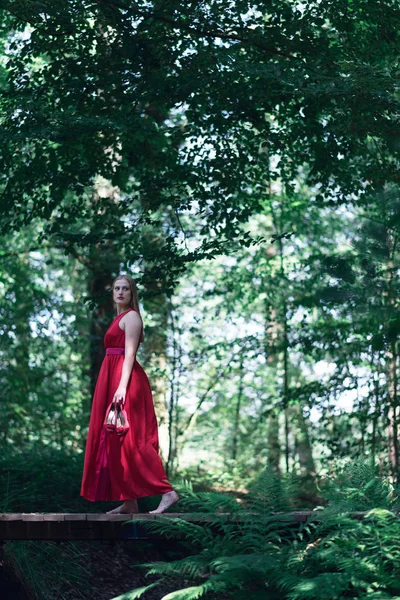 Woman Red Dress Crossing Wooden Bridge Summer Forest — Stock Photo, Image