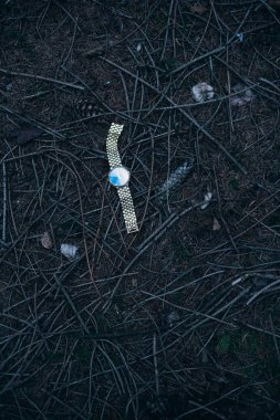 Lost watch on forest ground. clipart