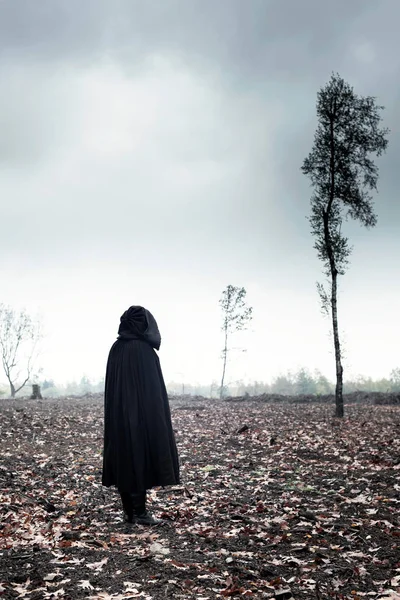 Woman Black Cape Moody Landscape — Stock Photo, Image