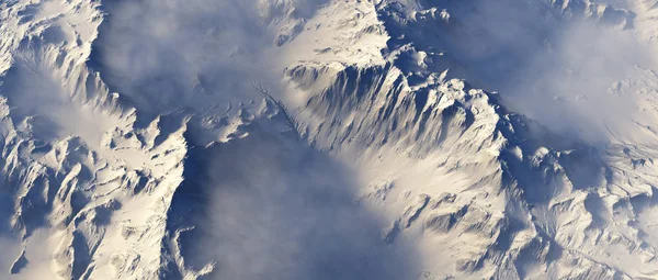 Aérea Montañas Cubiertas Nieve Las Nubes —  Fotos de Stock