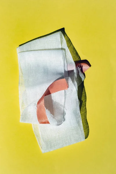 Bandage with tape on yellow. Top view. — Stock Photo, Image