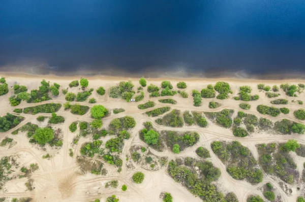 Top view aerial image from drone of an stunning beautiful river landscape beach with blue water.