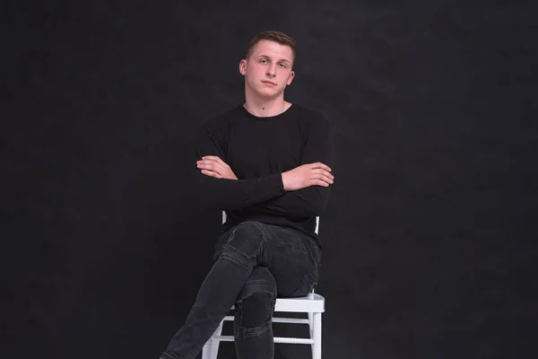 Portrait Cute Young Guy Sitting Chair Black Background Different Poses — Stock Photo, Image