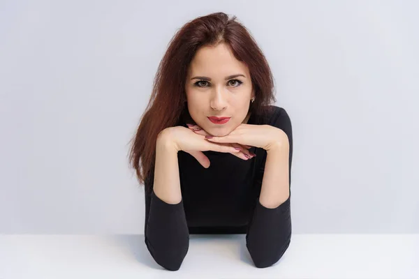 Concept Beautiful Brunette Girl Talking White Background Table She Sits — Stock Photo, Image