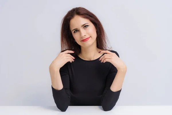 Concept Beautiful Brunette Girl Talking White Background Table She Sits — Stock Photo, Image