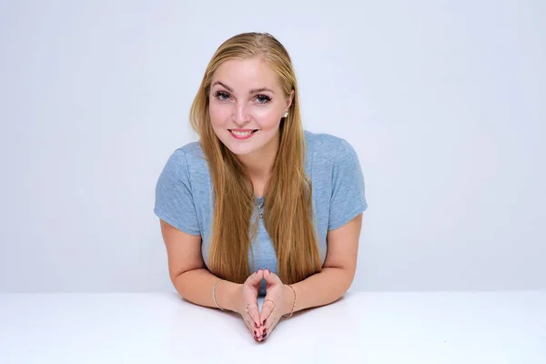 Portrait Beautiful Blonde Girl Table White Background She Sits Right — Stock Photo, Image