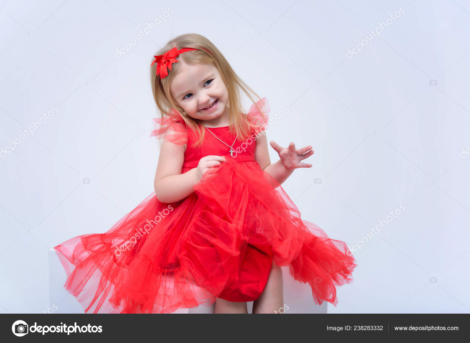 Premium Photo | Beautiful little girl smiles, child in autumn clothes poses  on a white background