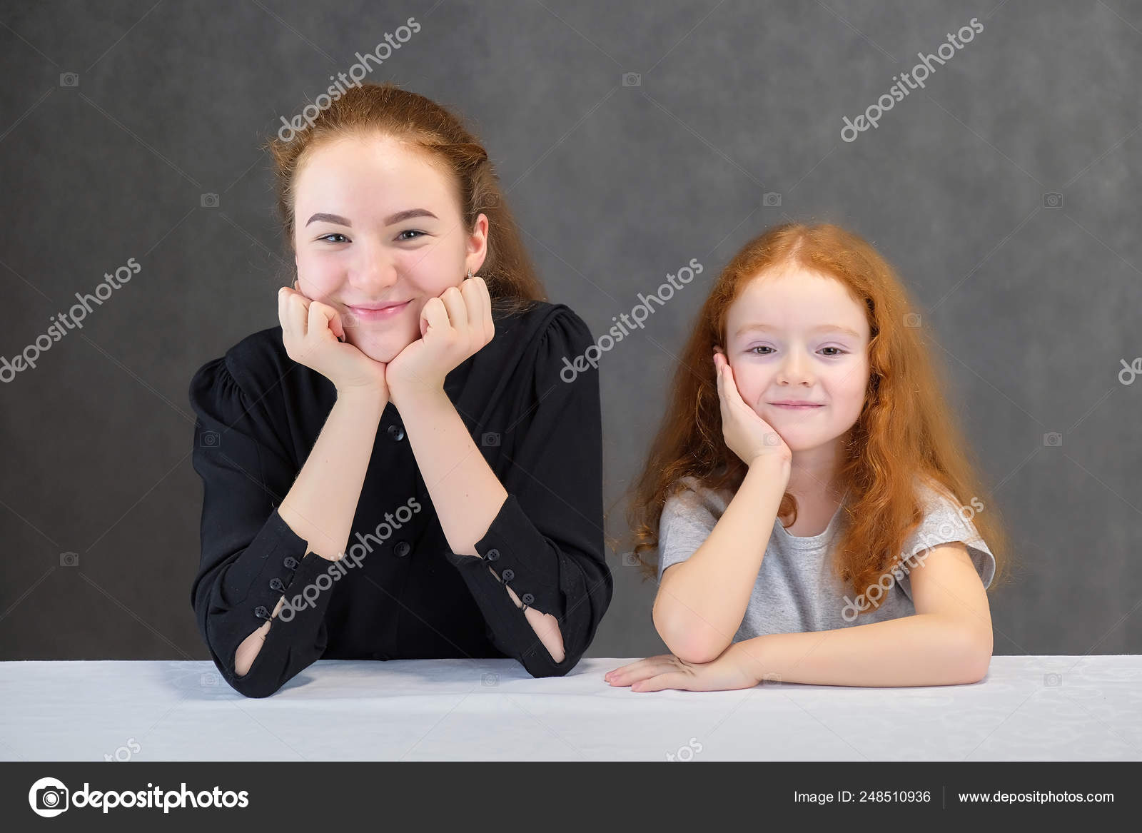 Concept Portrait Of Two Cute Pretty Girls Sisters With Red Hair On