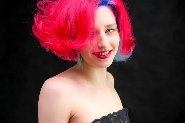 High fashion model woman with multi-colored hair posing in studio, portrait of beautiful sexy girl with a fashionable makeup and manicure. — Stock Photo, Image