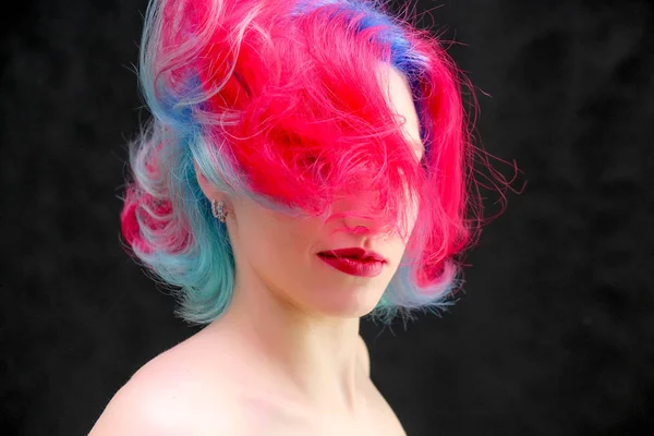 High fashion model woman with multi-colored hair posing in studio, portrait of beautiful sexy girl with a fashionable makeup and manicure. — Stock Photo, Image