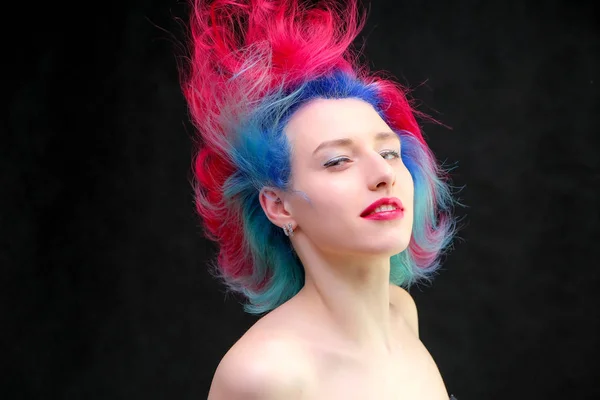 High fashion model woman with multi-colored hair posing in studio, portrait of beautiful sexy girl with a fashionable makeup and manicure. — Stock Photo, Image