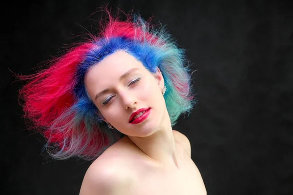 High fashion model woman with multi-colored hair posing in studio, portrait of beautiful sexy girl with a fashionable makeup and manicure. — Stock Photo, Image
