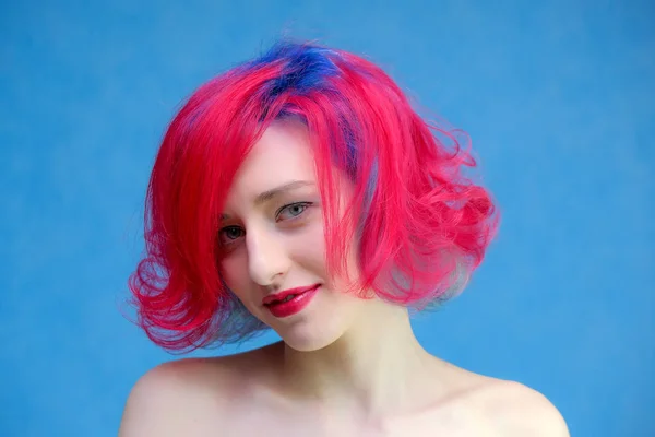 High fashion model woman with multi-colored hair posing in the studio, portrait of a beautiful sexy girl with a fashionable makeup and manicure. — Stock Photo, Image