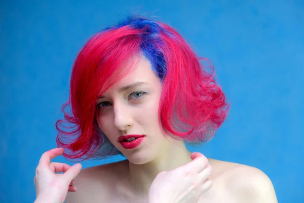 High fashion model woman with multi-colored hair posing in the studio, portrait of a beautiful sexy girl with a fashionable makeup and manicure. — Stock Photo, Image