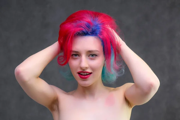 High fashion model woman with multi-colored hair posing in the studio, portrait of a beautiful sexy girl with a fashionable makeup. — Stock Photo, Image