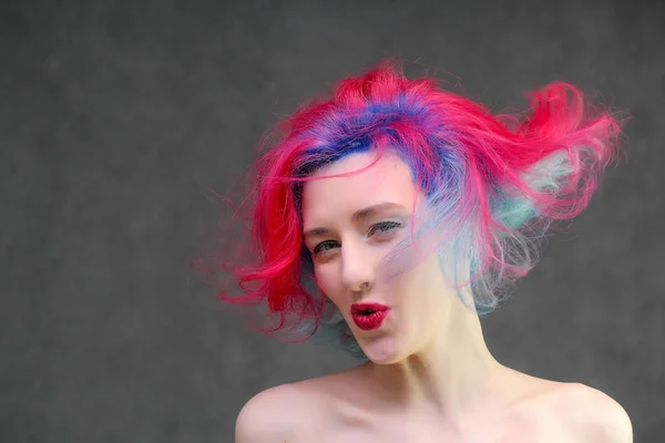 High fashion model woman with multi-colored hair posing in the studio, portrait of a beautiful sexy girl with a fashionable makeup. — Stock Photo, Image