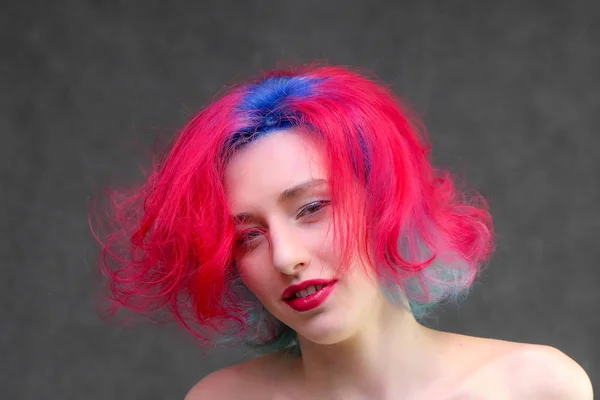 High fashion model woman with multi-colored hair posing in the studio, portrait of a beautiful sexy girl with a fashionable makeup. — Stock Photo, Image