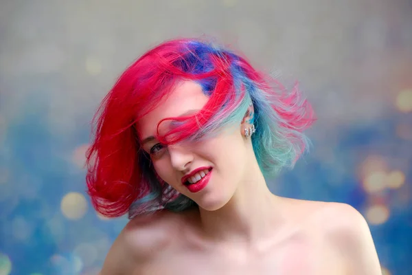 High fashion model woman with multi-colored hair posing in the studio, portrait of a beautiful sexy girl with a fashionable makeup — Stock Photo, Image