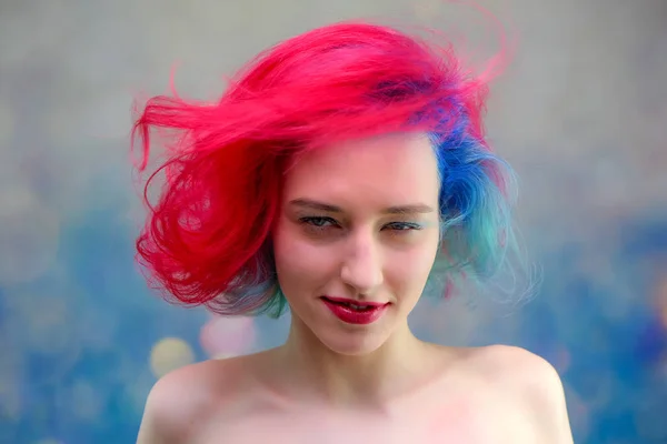 High fashion model woman with multi-colored hair posing in the studio, portrait of a beautiful sexy girl with a fashionable makeup — Stock Photo, Image