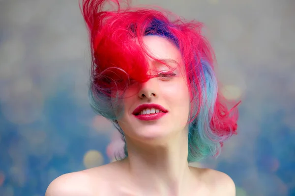 High fashion model woman with multi-colored hair posing in the studio, portrait of a beautiful sexy girl with a fashionable makeup — Stock Photo, Image