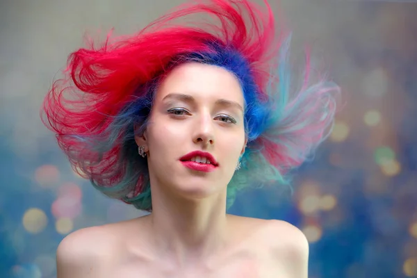 High fashion model woman with multi-colored hair posing in the studio, portrait of a beautiful sexy girl with a fashionable makeup — Stock Photo, Image