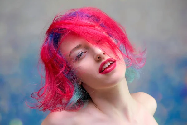 High fashion model woman with multi-colored hair posing in the studio, portrait of a beautiful sexy girl with a fashionable makeup — Stock Photo, Image