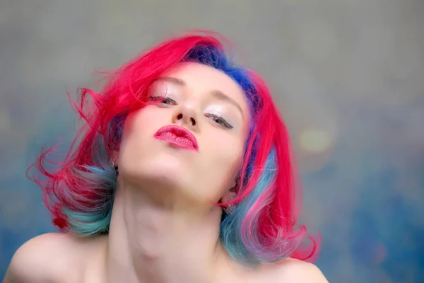 High fashion model woman with multi-colored hair posing in the studio, portrait of a beautiful sexy girl with a fashionable makeup — Stock Photo, Image