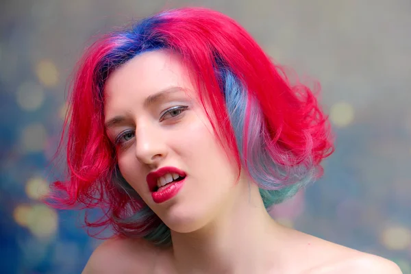 High fashion model woman with multi-colored hair posing in the studio, portrait of a beautiful sexy girl with a fashionable makeup — Stock Photo, Image