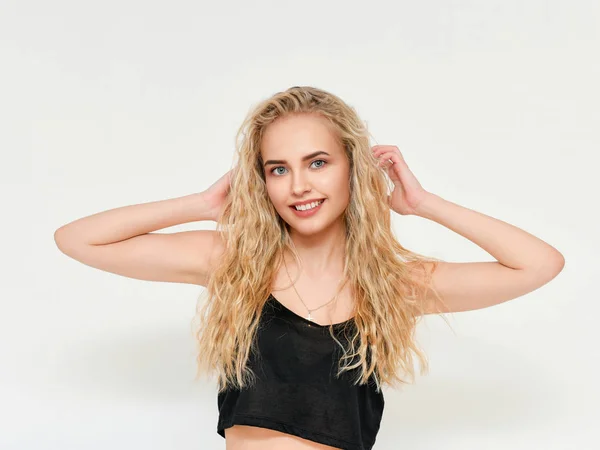 Photo of blond female model with white teeth looking at camera and smiling. Isolated on a white background — Stock Photo, Image