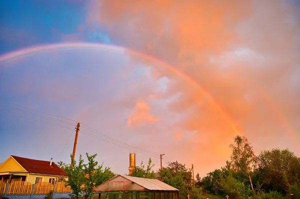 Landscape shooting. Photo of a rainbow in the sky