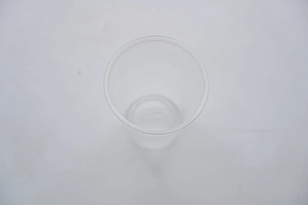 Concept Photo Plastic Glass White Table — Stock Photo, Image