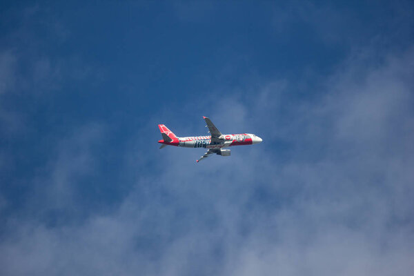 Chiangmai, Thailand - December 22 2018:  Airbus A320-200 of Thai Airasia. Take off from Chiangmai in blue sky.