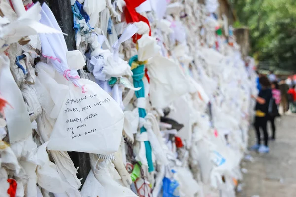 Many wishes on the wishing wall at the house of the Virgin Mary in Turkey.