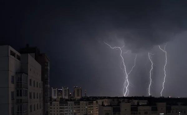 Lightning in the sky over the night city