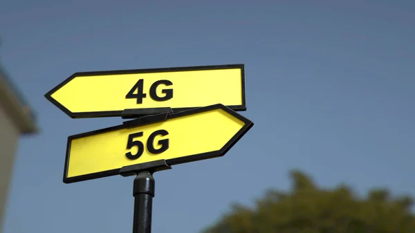 A road sign with 4G 5G words . 3d image.