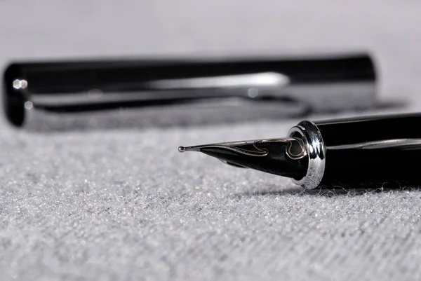 Set of pens for writing on a light background closeup. Shallow depth of field