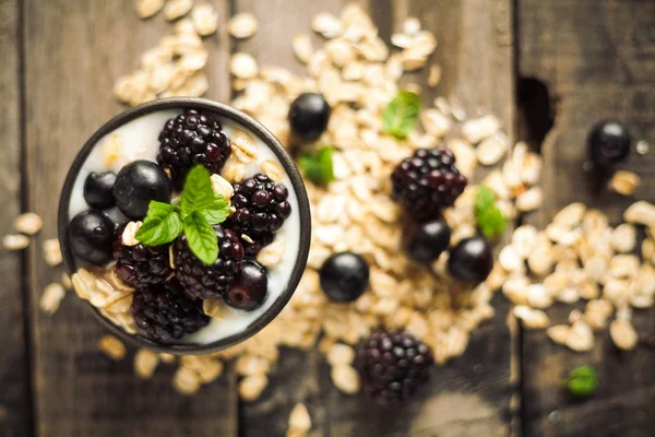 Proteic greek yogurts with fruits: blueberries and blackberries,