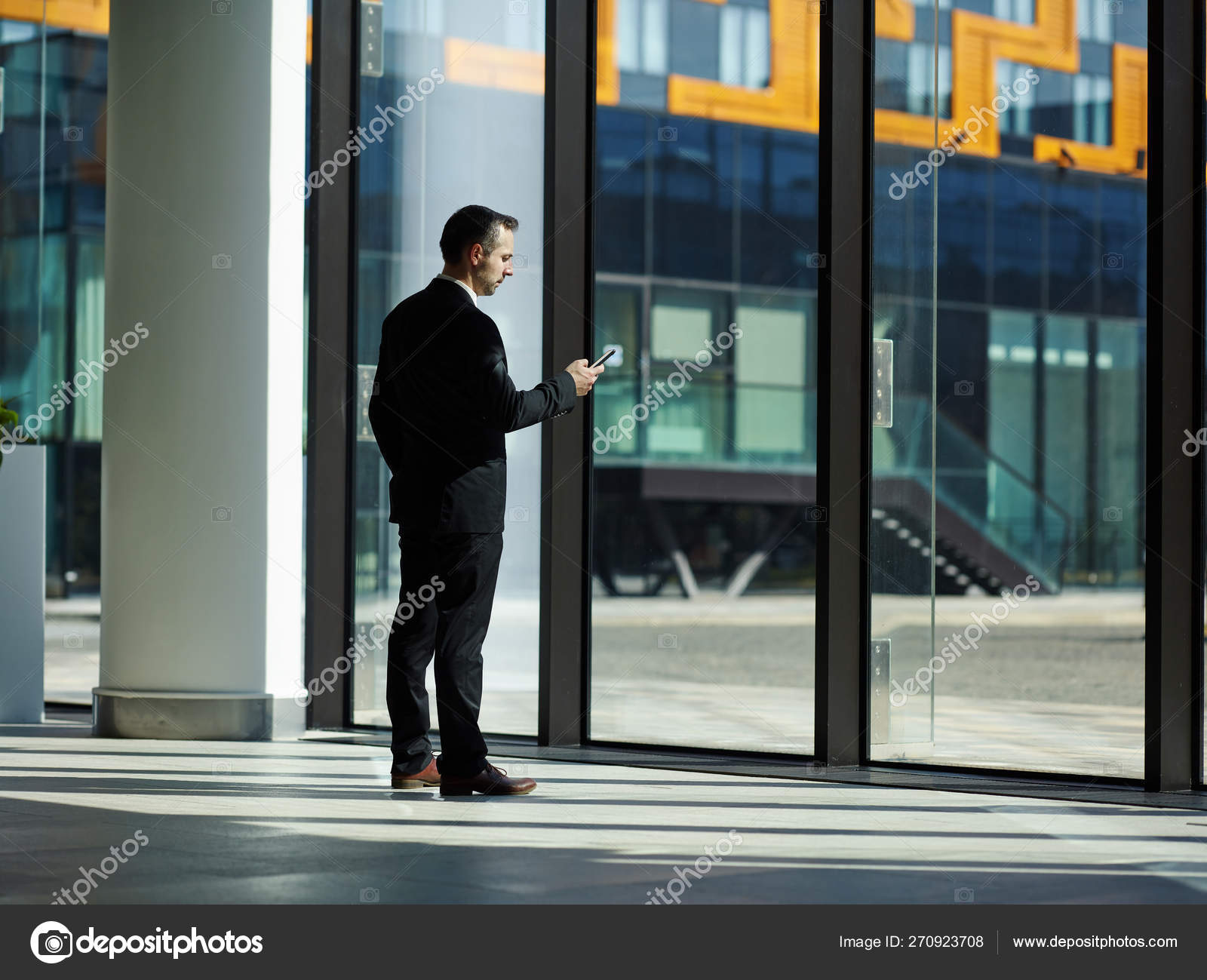 Businessman Formal Black Suit Standing Office Lobby Floor Length