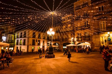Christmas light and people in Vigo - Galicia - Spain clipart