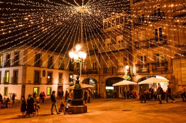 Christmas light and people in Vigo - Galicia - Spain clipart