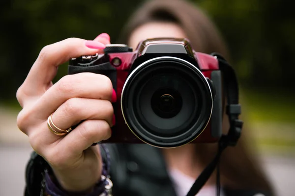 Camera close-up held in hands, training photos, photo Hobbies, walking during isolation, beautiful frames, lens close-up, photo lens