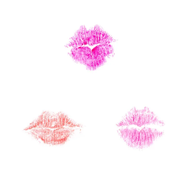 Colorful lips imprints of red, purple and pink lipstick shades isolated on a white background.